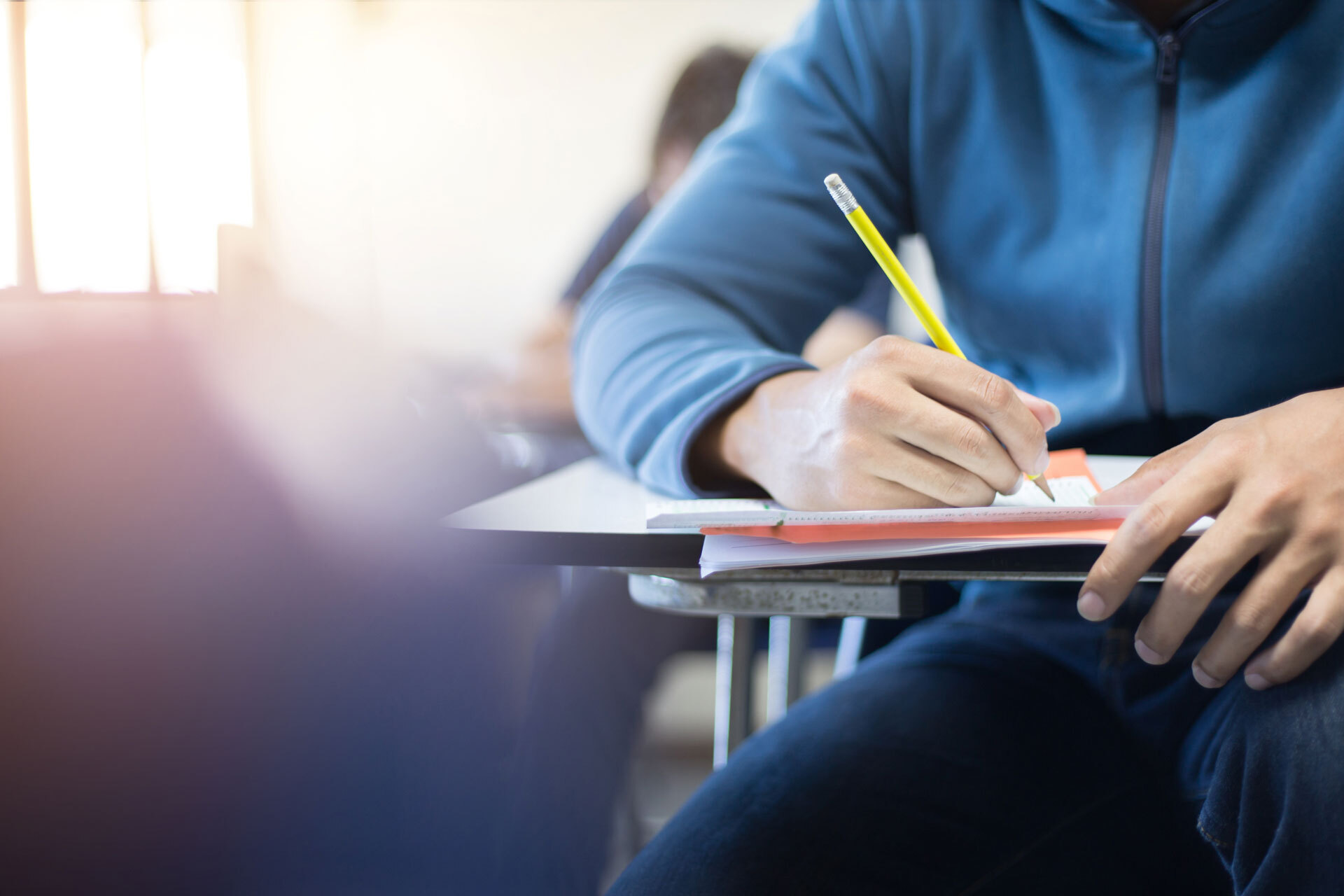 Students sitting exam paper
