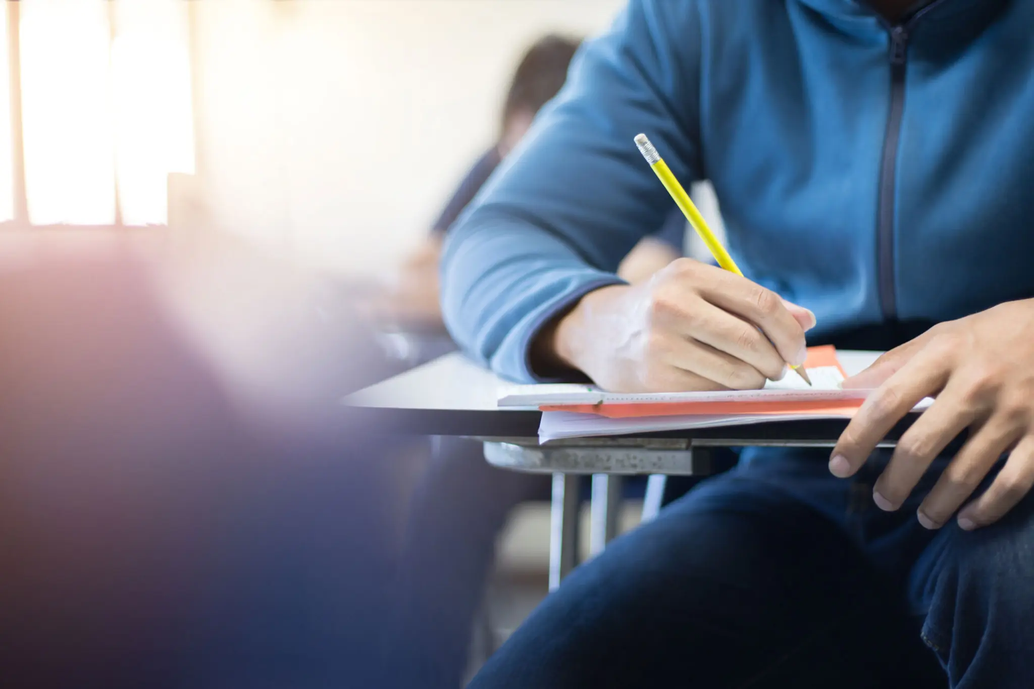 Students sitting exam paper