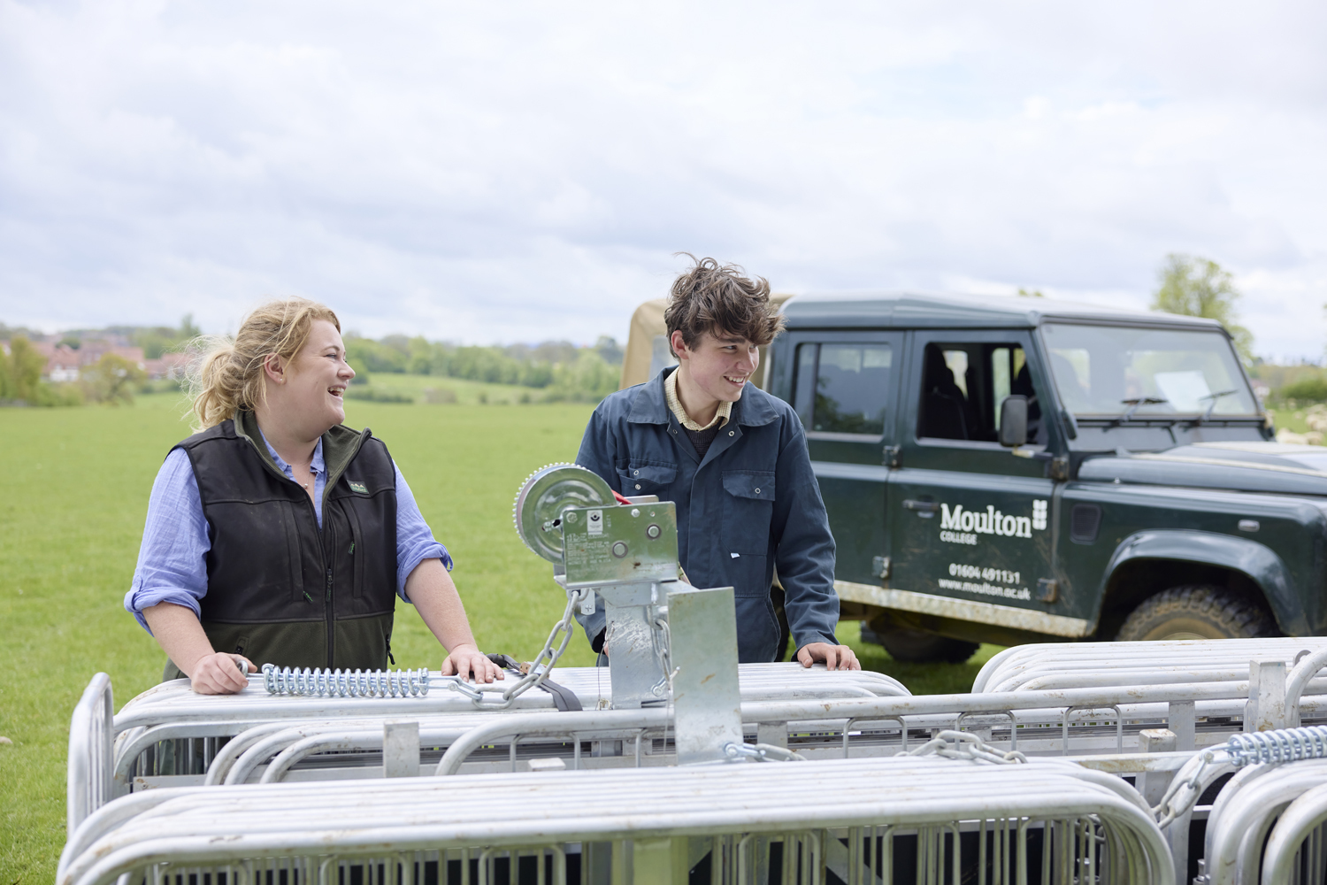 Lecturer and student with sheep handling system