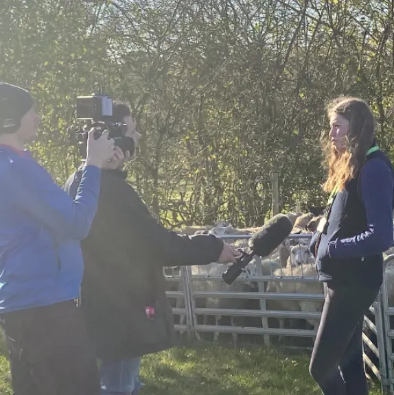 Media interviewing agriculture student