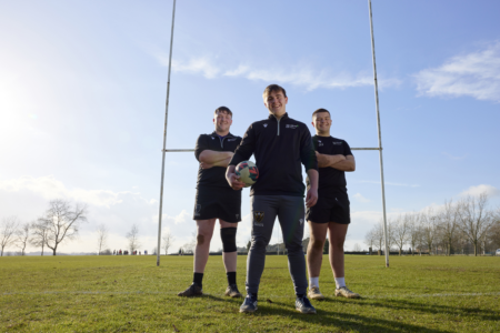 Rugby Academy boys team in front of post
